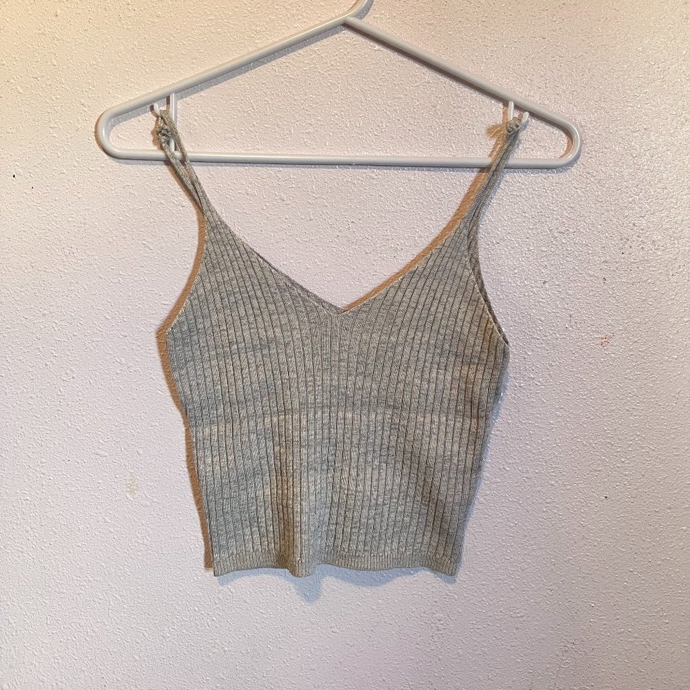semi-spaghetti tank top in a tanish color.